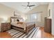 Spacious main bedroom with vaulted ceiling, a fan, wood floors, and a large window at 3214 S Bahama St, Aurora, CO 80013