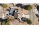 A bird's eye view of this brown roof home with large driveway and beautiful landscaping at 6367 Arapahoe Ct, Parker, CO 80134