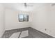 Bright bedroom with a neutral color scheme, a ceiling fan, and a window offering a neighborhood view at 6367 Arapahoe Ct, Parker, CO 80134