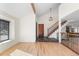 Inviting foyer with stairs and hardwood floors at 6367 Arapahoe Ct, Parker, CO 80134