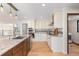 Charming kitchen showcasing a center island with granite countertops, stainless steel appliances, and custom cabinetry at 6367 Arapahoe Ct, Parker, CO 80134