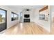 Bright living room with a fireplace, vaulted ceiling, and large windows at 6367 Arapahoe Ct, Parker, CO 80134