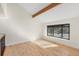 A cozy living room with vaulted ceilings, light hardwood floors, and a large window seat at 6367 Arapahoe Ct, Parker, CO 80134