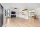 Bright living room with a fireplace, a vaulted ceiling, and large windows at 6367 Arapahoe Ct, Parker, CO 80134