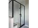 Modern bathroom shower with marble-style tiling and a black frame at 898 Coal Bank Trl, Castle Rock, CO 80104