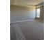 Spacious bedroom with large windows and a tray ceiling at 898 Coal Bank Trl, Castle Rock, CO 80104