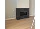 Modern fireplace with a dark stone surround, perfect for cozy nights at 898 Coal Bank Trl, Castle Rock, CO 80104