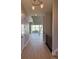 Bright hallway with a view of the open-concept living room and large windows at 898 Coal Bank Trl, Castle Rock, CO 80104