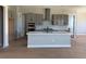 Spacious kitchen featuring gray cabinets, stainless steel appliances, and a large island at 898 Coal Bank Trl, Castle Rock, CO 80104