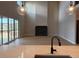 Living room featuring large sliding glass doors, high ceilings, and a modern fireplace at 898 Coal Bank Trl, Castle Rock, CO 80104