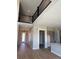 Open concept living area with dark iron railing and lots of natural light at 898 Coal Bank Trl, Castle Rock, CO 80104