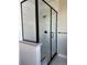 Modern shower with black trim, marble tile, and new fixtures, offering a spa-like experience at 898 Coal Bank Trl, Castle Rock, CO 80104