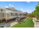 Backyard deck with a built-in outdoor kitchen and a well-maintained lawn at 4089 Forever Cir, Castle Rock, CO 80109