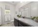 Bright bathroom with granite counters, bronze faucet and fixtures, plus view of the shower at 4089 Forever Cir, Castle Rock, CO 80109