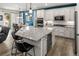 Bright and open kitchen featuring a large island, modern appliances, and direct access to the dining area at 4089 Forever Cir, Castle Rock, CO 80109