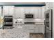 Beautiful kitchen with white cabinets, stainless steel appliances, granite counters, and subway tile backsplash at 4089 Forever Cir, Castle Rock, CO 80109