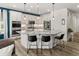 Modern kitchen featuring white cabinets, granite countertops, a large island, and stainless steel appliances at 4089 Forever Cir, Castle Rock, CO 80109