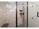 Tiled walk-in shower features a black shower head and built-in shelving at 4089 Forever Cir, Castle Rock, CO 80109