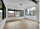 Large dining room with natural light, hardwood floors, and modern pendant lighting at 8132 Galileo Way, Littleton, CO 80125