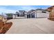 Beautifully designed home with three-car garage and modern architectural details at 8132 Galileo Way, Littleton, CO 80125