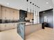 Modern kitchen with black marble countertops, stainless steel appliances, and stylish lighting at 8132 Galileo Way, Littleton, CO 80125
