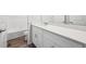 Bright bathroom featuring white cabinets and a shower-tub combo at 1352 Orchard St, Brighton, CO 80601