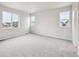Bright, carpeted bedroom featuring multiple windows providing plenty of natural light at 1352 Orchard St, Brighton, CO 80601