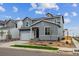 Stylish two-story home with a well-maintained lawn, attached garage, and desirable neighborhood setting at 1352 Orchard St, Brighton, CO 80601