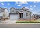 Charming two-story home with a two-car garage and well-manicured lawn in a suburban neighborhood at 1352 Orchard St, Brighton, CO 80601