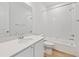 Modern bathroom with a shower-tub combination, white subway tile surround, and updated vanity at 200 Lark Sparrow Way, Bennett, CO 80102