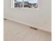 Bright, carpeted bedroom with natural light streaming through the window, offering a serene and inviting atmosphere at 200 Lark Sparrow Way, Bennett, CO 80102