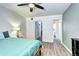 Bright bedroom features wood floors, ensuite bath and closet at 420 Wright St # 101, Lakewood, CO 80228
