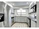 Modern kitchen features stainless steel appliances and ample counter space at 420 Wright St # 101, Lakewood, CO 80228