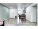 Bright living room features wood floors, eating area, and view into kitchen at 420 Wright St # 101, Lakewood, CO 80228