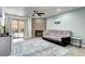 Cozy living room features a stone fireplace and sliding glass doors to patio at 420 Wright St # 101, Lakewood, CO 80228