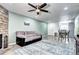 Inviting living room boasts a stone fireplace, hardwood floors, and a seamless transition to the dining area at 420 Wright St # 101, Lakewood, CO 80228