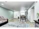 Bright living room features wood floors, eating area, and view into kitchen at 420 Wright St # 101, Lakewood, CO 80228