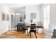 Bright breakfast nook featuring a cozy banquette seating and modern stainless steel appliances at 1000 N Ogden St, Denver, CO 80218