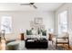 Bright living room with white sofa, stylish coffee table, and decorative art creating a cozy atmosphere at 1000 N Ogden St, Denver, CO 80218