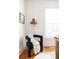 Cozy corner with a stylish armchair, woven lamp, and natural light from the window at 1000 N Ogden St, Denver, CO 80218