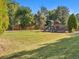 Backyard with large grassy area and playground set at 5809 E Caley Dr, Centennial, CO 80111