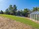 Large backyard with trampoline, greenhouse, and playset at 5809 E Caley Dr, Centennial, CO 80111
