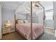 Bedroom with canopy bed, plush bedding, and ample closet space at 5809 E Caley Dr, Centennial, CO 80111
