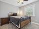 Bedroom with metal bed frame, window coverings, and nightstand at 5809 E Caley Dr, Centennial, CO 80111