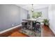 Dining room with hardwood floors and modern light fixture at 5809 E Caley Dr, Centennial, CO 80111