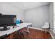 Home office with hardwood floors and modern desk setup at 5809 E Caley Dr, Centennial, CO 80111