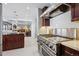 Modern kitchen features a stainless steel range, hood, and expansive countertops at 5809 E Caley Dr, Centennial, CO 80111