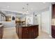 Kitchen island with sink, storage, and breakfast bar seating at 5809 E Caley Dr, Centennial, CO 80111