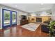 Living room with hardwood floors, fireplace, and French doors leading to the backyard at 5809 E Caley Dr, Centennial, CO 80111