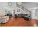 Spacious living room with hardwood floors, high ceilings, and an open floor plan at 5809 E Caley Dr, Centennial, CO 80111